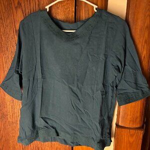 Dark teal shirt with intricate threadwork